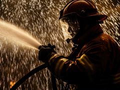 firefighter spraying water